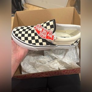 Brand new in box black and white checkered slip on vans